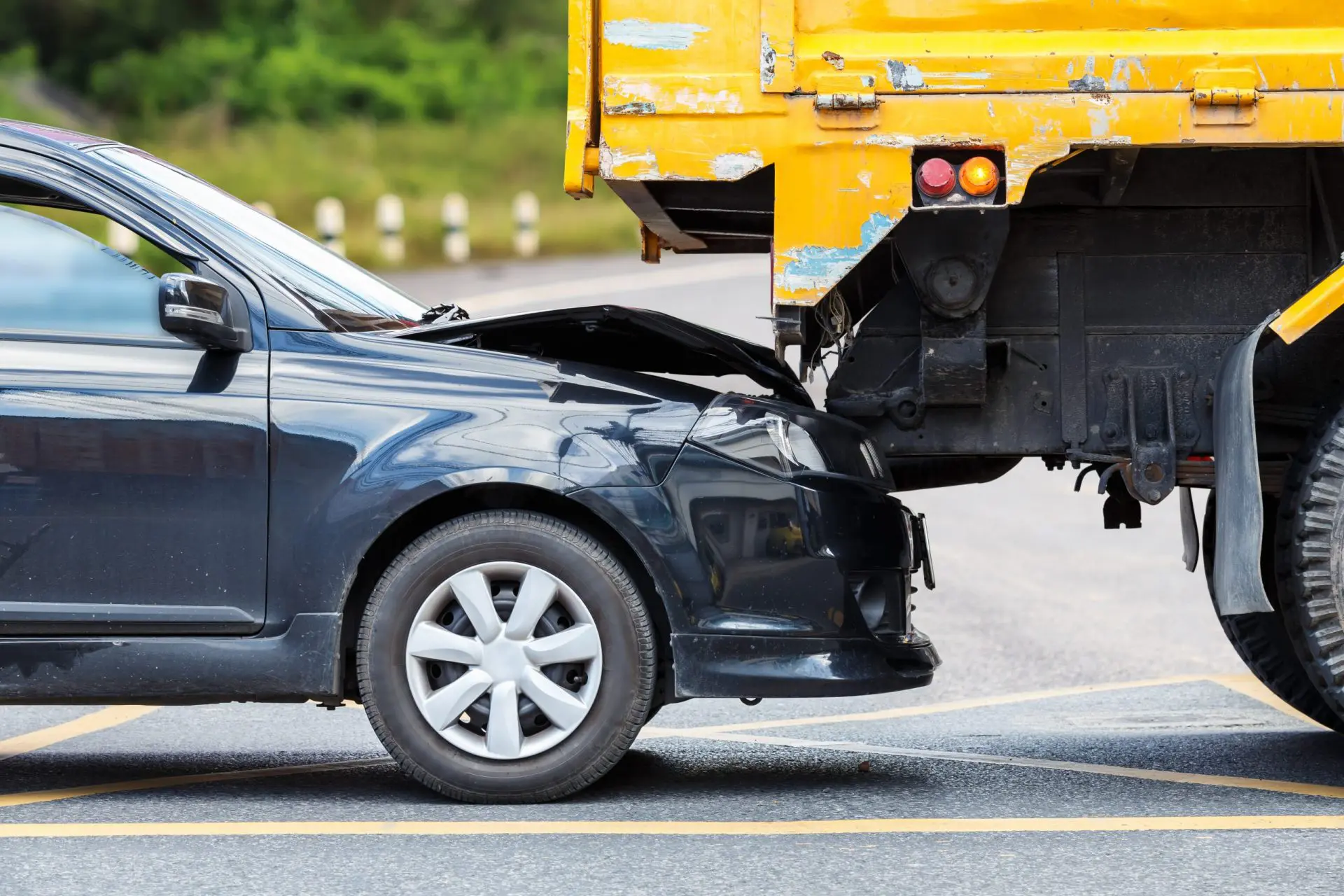 Accident,On,The,Road,Involving,Black,Car,And,Yellow,Truck